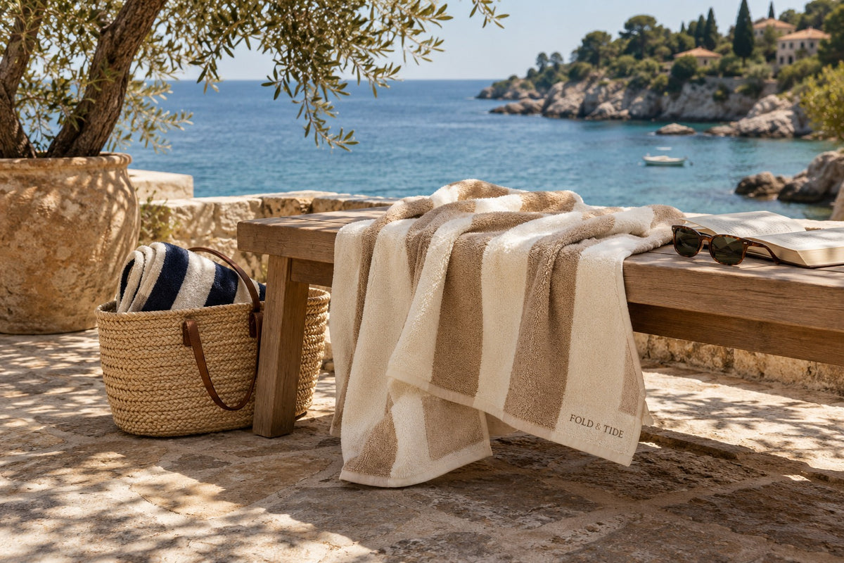 Fold & Tide striped towels on a Mediterranean terrace — collection mood concept